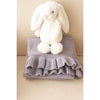 Organic Frill Blanket Lilac Speckle folded with a stuffed bunny on top