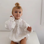  Infant model wearing Baby Jean Romper